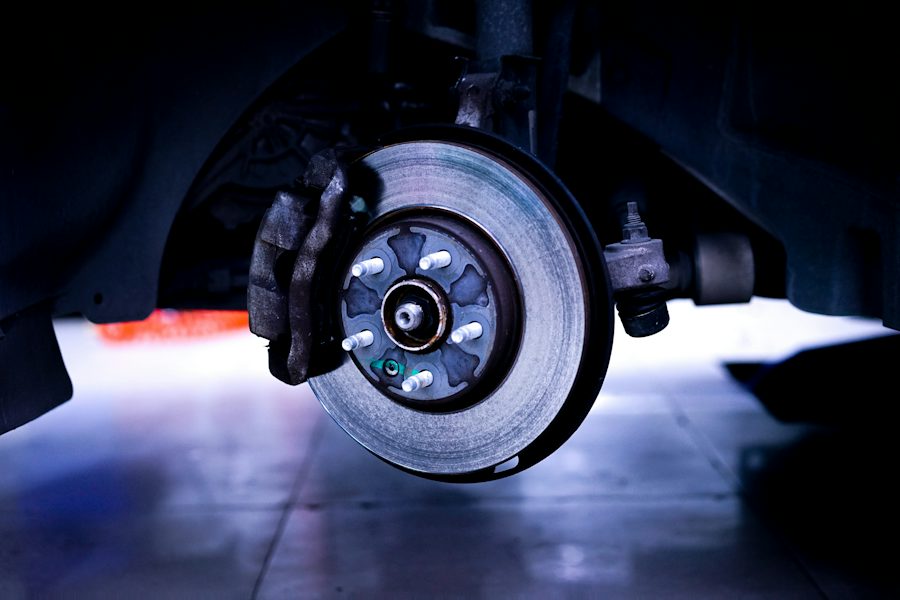 Brake rotor and caliper on a car lifted with the wheel off